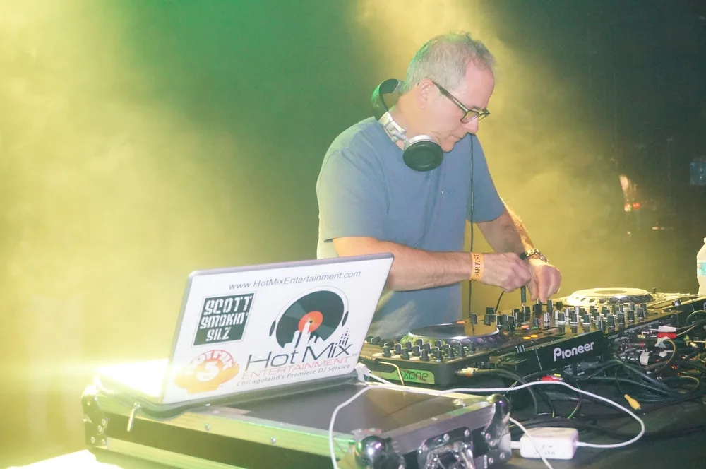 Corporate event with professional DJ setup and dance floor