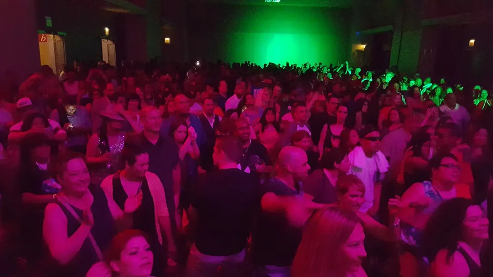 Live performance event with crowd dancing