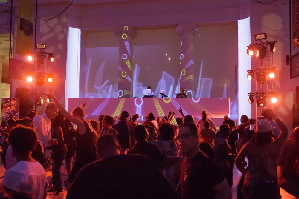 Hot Mix party with guests dancing under colorful lights