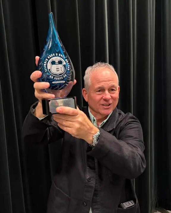Scott Smokin' Silz holding his Illinois Rock & Roll Hall of Fame trophy, September 2026
